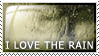 Rain falling against a window with text 'I love the rain'